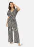 Yumi Black Geometric Print Wrap Jumpsuit - Size 16 Image 1
