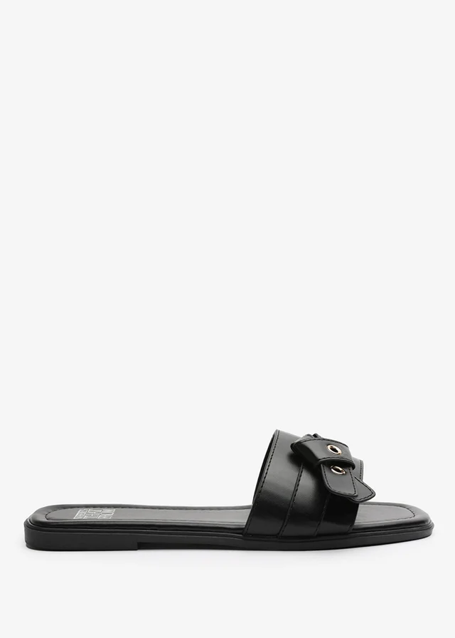 Where's That From Lucy Black Slip-On Sandals with Buckle Accent