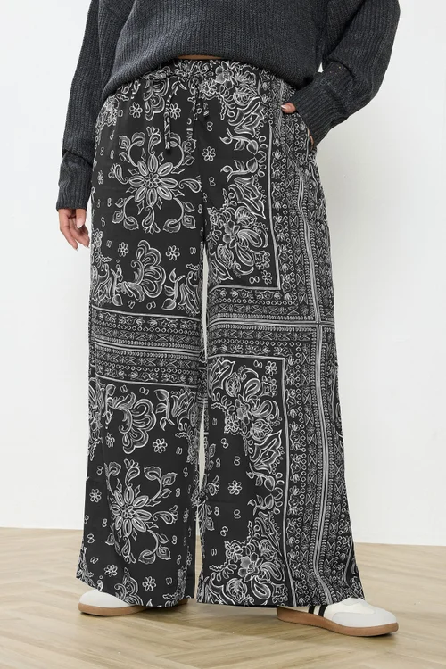 Yours Curve Black Paisley Wide Leg Trousers - 20 Image 1