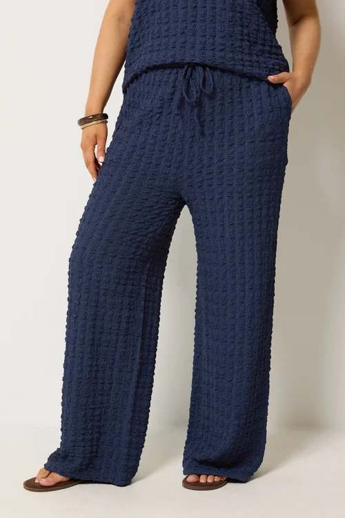 Yours Curve Navy Blue Bubble Textured Wide Leg Trousers - 26-28/L28 Image 1