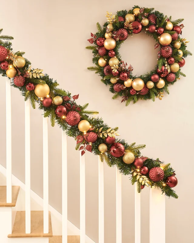 WeRChristmas Multi-Colour Pre-Lit Artificial Christmas Garland With Burgundy And Gold Baubles 100 Warm White Leds 9 Ft