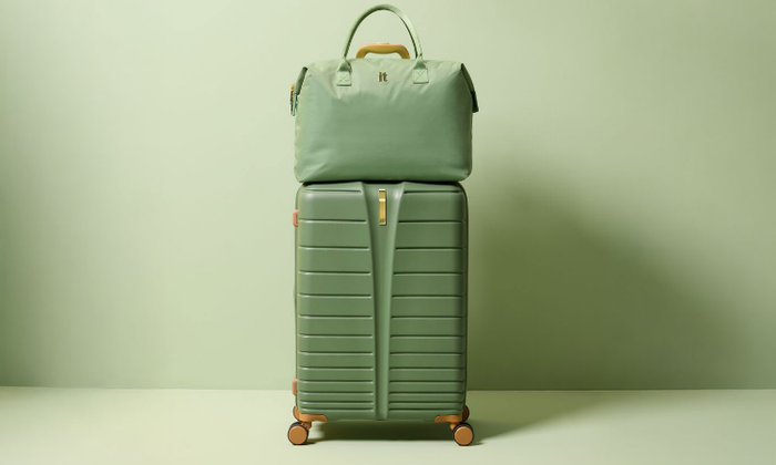 Green hardshell suitcase with matching underseat bag